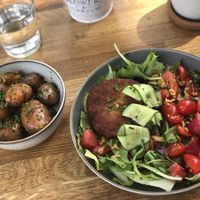 Custom meal consisting falafel patty (from burger), salat and herb roasted potatoes (from sides menu) at NOKK in Tartu