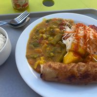 I got a random selection, but we have: rice, green curry, two rolls, a tofu spring roll, pickled cabbage and roast carrot and beets underneath :))  at Loving Hut - Vinohrady in Prague