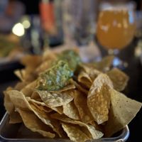 House made chips with guacamole, hazy IPA  at Lovecraft in Phoenix