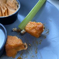 Tofu bites came with celery. Small portion. Maybe 7 squares. Came with vegan ranch.   at Sage Karma Kitchen in Willoughby