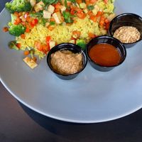 Thai Dye Bowl with tofu added, and peanuts, siracha, and peanut sauce on the side.  at Sage Karma Kitchen in Willoughby