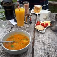 My butterbean soup (Vg), Dad's cheese platter (not Vg) and a glass of orange juice with sparkling water. at Abriachan Cafe Campsite Wester Laide in Abriachan