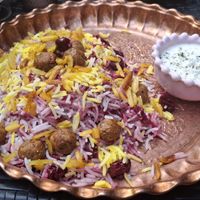 Reisgericht mit Kirschen, Mandeln, Zimt und veganen Hackbällchen at Zarathustra in Cologne