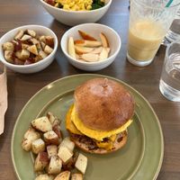 Breakfast bowl and a sausage, egg, and cheese with a side of potatoes and fruit at Earthly Cafe in Somers Point