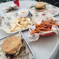 Vegan bacon cheeseburger, sweet potato fries, chips and hummus at The Cove in San Antonio