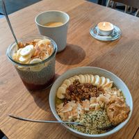 Latte with oat milk (30 DKK), Red Berry Chia Special (75 DKK), Mango Matcha Bowl (85 DKK) at GRØD - Birkegade in Copenhagen