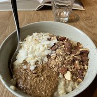 Vegan porridge with almundbutter, coco and almunds 😍  at GRØD - Birkegade in Copenhagen