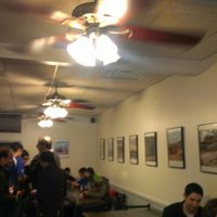 dining area with nice photos on the wall at Blackbird Pizzeria - 6th St in Philadelphia