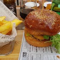 Veggie burger eith chickpeas, fried onion rings and rocket salad. at Agrippina Street Food in Pula