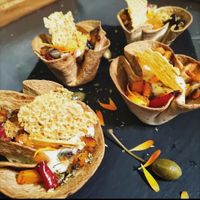 Nidos rellenos de verduras de temporada, y queso parmesano vegano at Bar Caleya Indi in Colunga