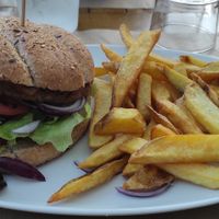 Beetroot burger with spicy sauce and fries. at Meltin' in Moliets