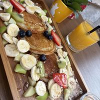 Pancakes with Peanutbutter, jam and fruits 🥞🍓🍌 + Fresh orange juice   at Feel Green in Split