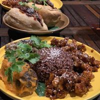 Red rice, orange chicken, tomato tofu balls, eggplant stew  at Peanuts in Hoi An