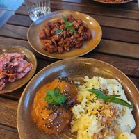 Mash, orange chicken, tomato 'meatballs' and kimchi at Peanuts in Hoi An