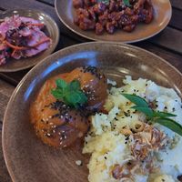 Mash, orange chicken, tomato 'meatballs' and kimchi at Peanuts in Hoi An