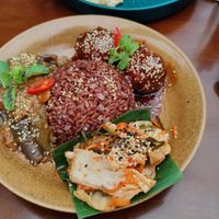 Red rice, eggplant stew, tofu balls and kimchi at Peanuts in Hoi An