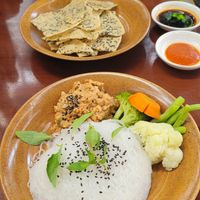 Noodles/red rice with peanut stew, steamed veggies and rice crackers at Peanuts in Hoi An