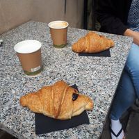 Sweet croissants with berry jam and coffee with soymilk at Il Pane Quotidiano Lungomare in Trieste