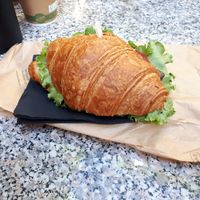 Salty croissant with salad, grilled aubergine and tomatoes at Il Pane Quotidiano Lungomare in Trieste