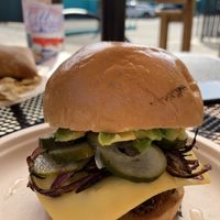 Homemade Patty, pickles, + pina bun😍   at Moksha in Rincon