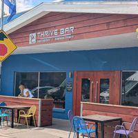 Exterior with patio seating at Alua's Thrive Bar in Mount Shasta