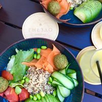 Vegan bowl with falafel: falafel, avocado, quinoa, carrots, edamame, tomatoes, cucumber, salad mix at Gnezdo in Tula