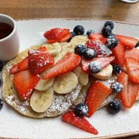 Pancakes with fruit and maple syrup (vegan on request) at Walnuts in Orpington