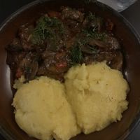 Mushroom stew with polentaa  at Caru' cu Bere in Bucharest