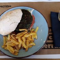 Vegan burger with fries. at Port Blau in Lestartit