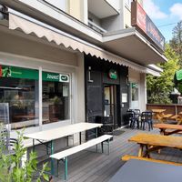 Outdoor seating in the front at L'Imprevu Cafe in Fribourg