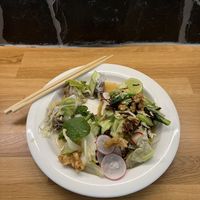 Dim sum hernis and Burmese tea leaves spicy salad.  at Thai Vegan Kitchen in Helsinki