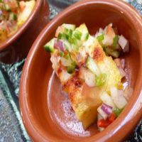 Spice dusted polenta with the restaurant's own vegan cheese and chilli salsa. at Hectors Restaurant in Auckland