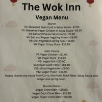 Menu , they need to update this and add the cheesecake to it   at Woks Bar and Restaurant in Brandon