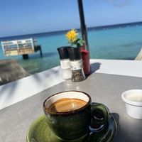Strong coffee with soy milk with this view  at Karakter in Willemstad
