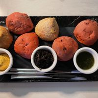 Bread basket - the onion dip in the middle is vegan. The other dips are not. They also brought out olive oil for me as a vegan dip option.   at Karakter in Willemstad