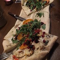 Veganized Pinsa (with soy yogurt instead of crème fraîche) with beets, sweet potato, arugula and pomegranate   at Landwehr - Bräu am Turm in Rothenburg Ob Der Tauber