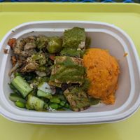 Tofu, seasonal lemon-herb vinaigrette, sweet potato, cucumber salad, roasted veggies at Maepole in Atlanta