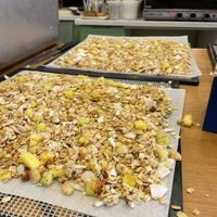 Roasting nuts and seeds at Noon Good Food in Urla