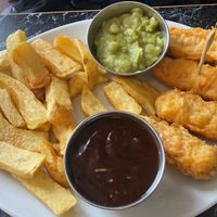 Sausages and gravy w extra peas  at Neptune Fish Restaurant in Seahouses