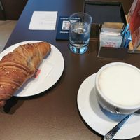 Vegan croissant and soya milk cappuccino at Illy Caffé in Trieste