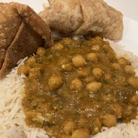 Chana masala with puree and samosa  at Spice King Renton in Renton