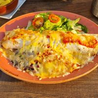 Burrito with vegan mince, beans, rice, guacamole & salad at De Duinerij in Bergen Aan Zee