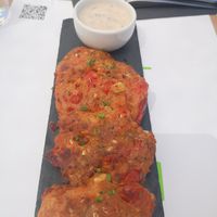 Appetizer tomatoes, onion fried balls at 5SENSES Restaurant in Santorini