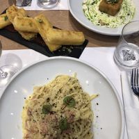 2 appetizers (left to right: saganaki and polenta) - and carbonara   at 5SENSES Restaurant in Santorini