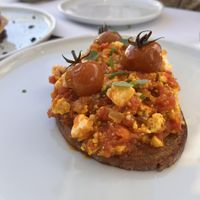 Kayanas “soft scrambled egg” it honestly taste even 10x better than it looks. Full of flavor and the protein mixed with the cheese and bread at the bottom is pretty filling.  at 5SENSES Restaurant in Santorini
