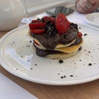 Chocolate mound. Chocolate strawberries are amazing. The pancakes aren’t the light, fluffy, airy style. More dense and dough-cake like. Very sweet, but of course expected   at 5SENSES Restaurant in Santorini