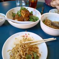 super garlicky noodles in foreground, crispy soft tofu in impossible mapo sauce in background at Best Quality Daughter in San Antonio