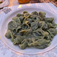 Spinach manti, no dressing. They ran out of yogurt but provided a small tomato salsa at Fatma Sultan in Antalya
