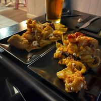 Coliflower wings, nachos, potatoes, and seitan at Faroles Taberna Rock in Valladolid