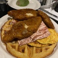 Cornmeal & cheddar waffle topped with buffalo maple chicken with bacon and JUST egg 😋  at Champs Diner in Brooklyn
